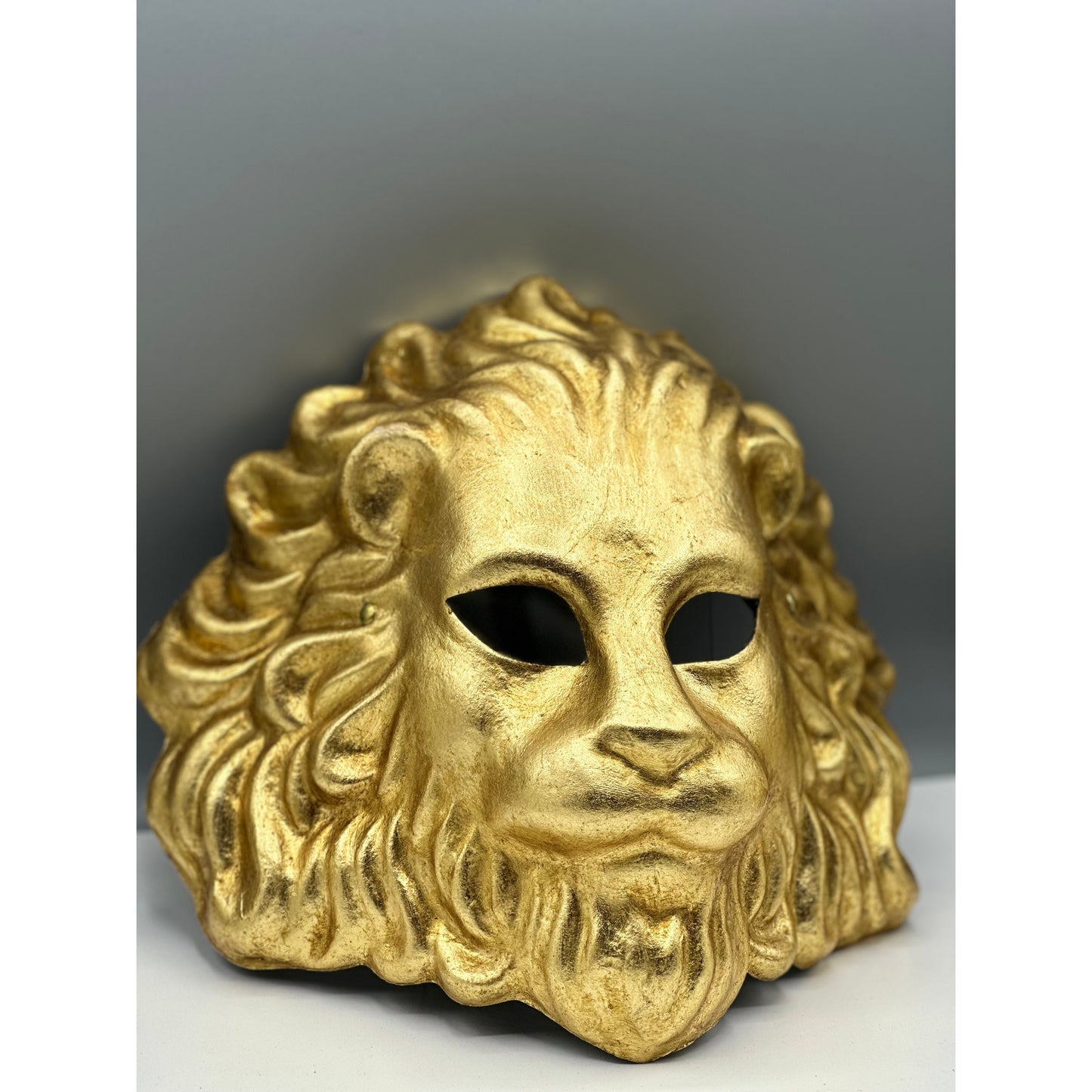 Venetian-style golden lion face mask for masquerade or décor
