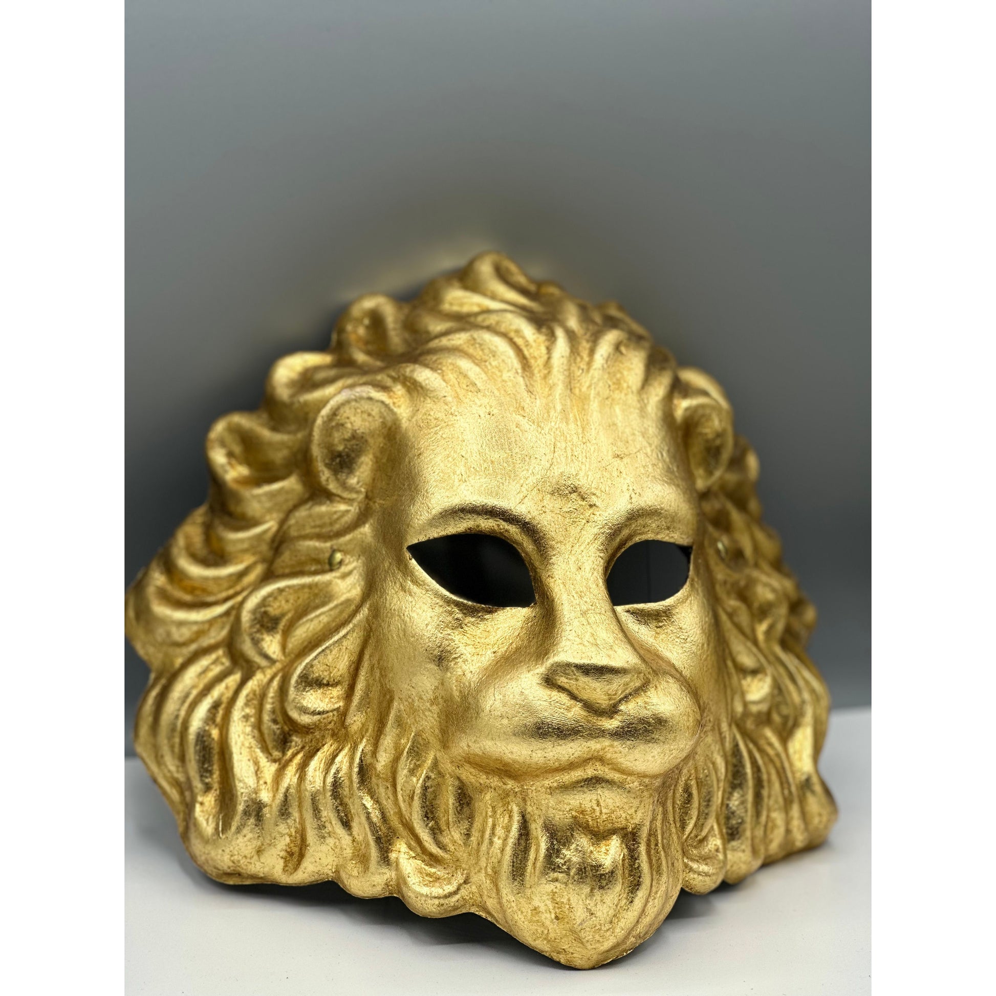 Venetian-style golden lion face mask for masquerade or décor